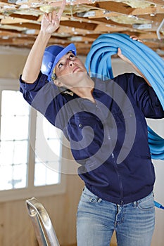 female worker holding cables