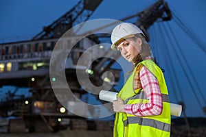 female worker holding scheme on rails on backgroud photo