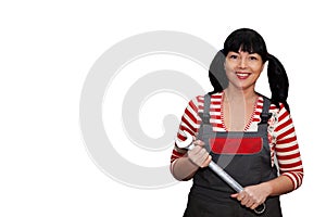 Female worker holding a wrench