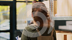 Female worker inspecting products list