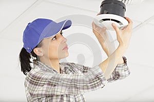 female worker during maintenance air conditioning filter