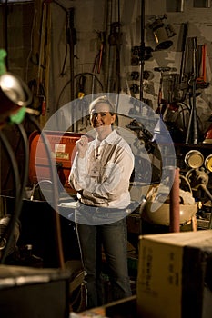 Female worker in office storage room