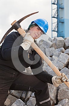 Female worker with pickaxe