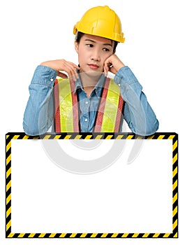 Female worker with Protection Equipment, posing behind big white