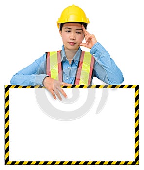 Female worker with Protection Equipment, posing behind big white