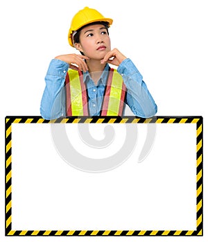 Female worker with Protection Equipment, posing behind big white
