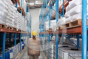 Female worker standing in warehouse