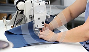 Female worker on textile production industry photo