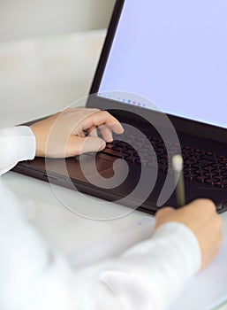 Female worker typing on the keyboard. Distance learning, education online. Online working from home, business and