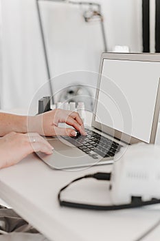 Female working on the laptop, blank screen template