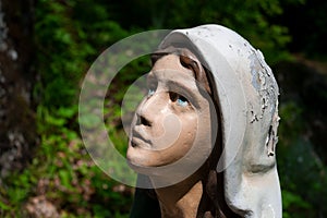 Female worshipper and prayer is looking up the God or Virgin Mary photo