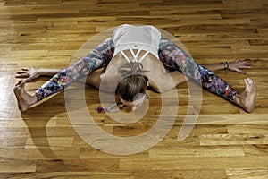 Female Yoga Model Kurmasana Tortoise Pose Overhead