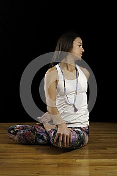 Female Yoga Model Seated Twist Facing Camera