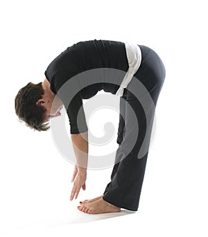Female yoga position toe touch hamstring stretch