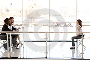 Female young job applicant at job interview in office boardroom