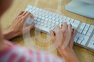 femalehands typing on a keyboard