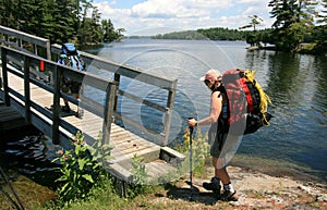 Females Backpacking Across Bridge photo