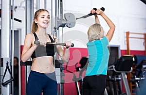 Females of different age strength training in gym