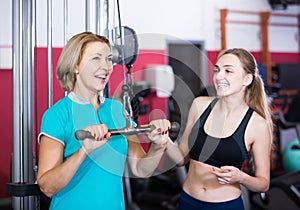 Females of different age strength training in gym