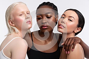Females with different complexion posing together in photo shoot