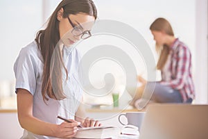 Females reading in office