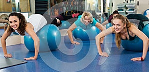 Females working out with aerobic ball