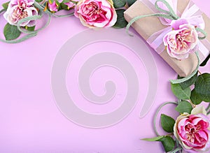 Feminine background with gift and silk roses