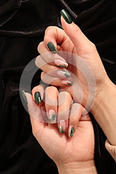 Feminine decorated nails with green colors