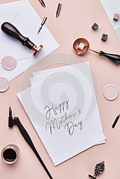 Feminine desk workspace with quote: Happy Mother`s Day