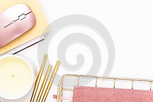 Feminine desktop with gold and pink stationery including a keyboard and mouse