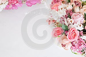 Feminine floral frame composition. Decorative web banner made of beautiful pink peonies. White background. Empty space. Flat lay,