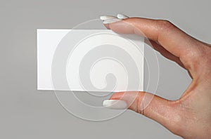 Feminine Hand Holding Business Card