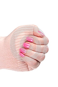 Feminine hand with stylish pink manicure on fingers.