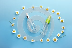 Feminine hygiene Chamomile flowers composition on blue background