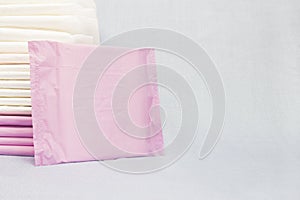 Feminine hygiene products, menstrual sanitary pads for first menstruation. Personal care, woman hygiene conception photo. Soft ten