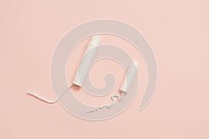 Feminine hygienic tampons on pink background. Menstruation