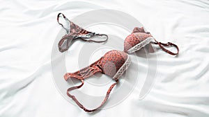 Feminine lingerie women bra tanga panties bed photo