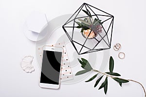 feminine tabletop flatlay with smartphone mock-up