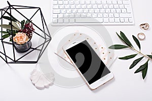 feminine tabletop flatlay with smartphone mock-up