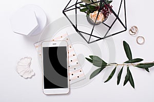 feminine tabletop flatlay with smartphone mock-up