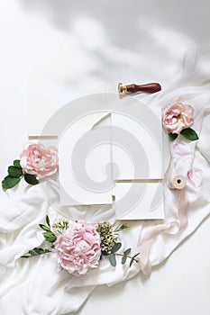 Feminine vertical wedding, birthday mock-up scene. Blank paper greeting cards, envelope, ucalyptus, pink roses, peony