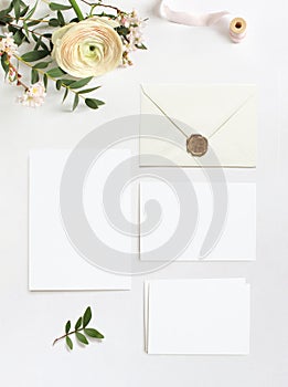 Feminine wedding, birthday desktop mock-ups. Blank greeting cards, envelope. Eucalyptus branches, pink cherry tree