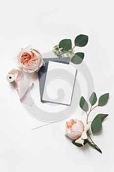 Feminine wedding, birthday mock-up scene. Blank paper greeting cards, envelope, silk ribbon, eucalyptus leaves and blush