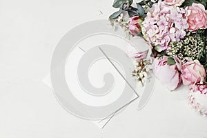 Feminine wedding, birthday mock-up scene. Decorative floral corner of peony, hydrangea, roses and locust flowers. Blank