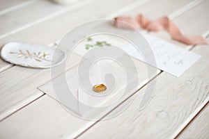 Feminine wedding desktop mock-up with blank paper card and Eucalyptus populus branch on white shabby table background