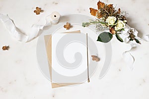 Feminine winter wedding, birthday stationery mock-up scene. Blank greeting card, envelope. Dry hydrangea, white roses