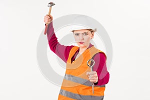 Feminism concept. Woman with strict face holds hammer,