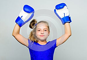 Feminist movement. She feels as winner. Upbringing for leadership and winner. Strong child proud winner boxing