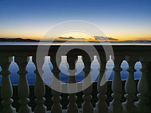 Fence against the backdrop of a sunset seascape