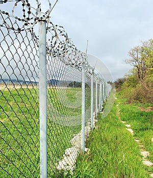 Fence with barbed wire.